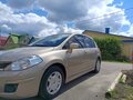 2010 Nissan Tiida I, коричневый - вид 2