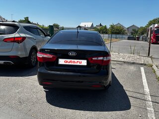 2013 Kia Rio 5-speed III, чёрный, 700000 рублей, вид 5