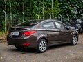 2014 Hyundai Solaris I Рестайлинг, коричневый, 875000 рублей - вид 1