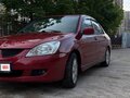 2004 Mitsubishi Lancer IX, красный
