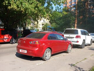 2008 Mitsubishi Lancer X, красный, 600000 рублей, вид 1