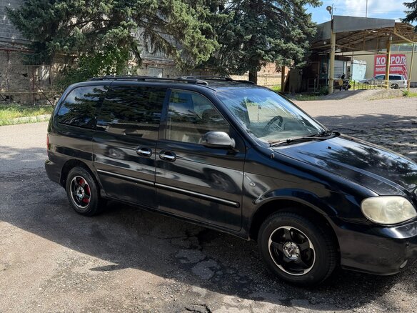 2005 Kia Carnival I Рестайлинг, чёрный - вид 2