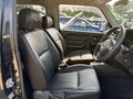 2010 Suzuki Jimny Kei car III Рестайлинг 1, чёрный - вид 1