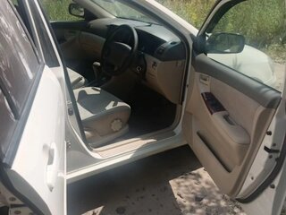 2001 Toyota Corolla IX (E120, E130), белый, 400000 рублей, вид 5