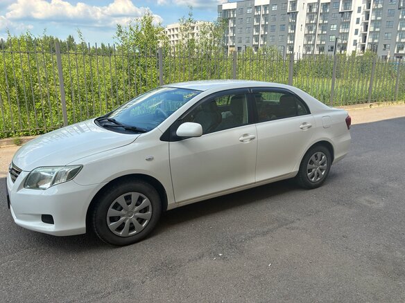 2010 Toyota Corolla Axio X (E140, E150) Рестайлинг, белый, 740000 рублей - вид 1