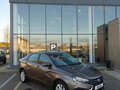 2026 Lada (ВАЗ) Vesta I Рестайлинг (NG), коричневый, 1835900 рублей - вид 1