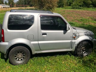2011 Suzuki Jimny III Рестайлинг 1, серебристый, 870000 рублей, вид 3