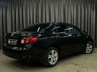 2010 Toyota Corolla X (E140, E150), чёрный, 689777 рублей, вид 3