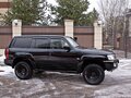 2004 Nissan Patrol V (Y61) Рестайлинг, чёрный - вид 3