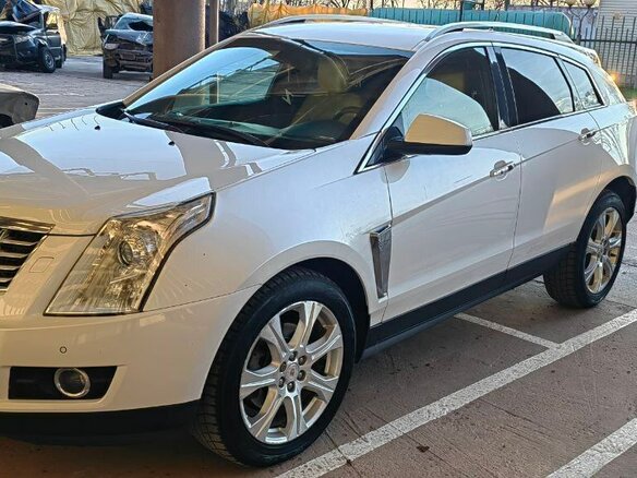 2014 Cadillac SRX II Рестайлинг, белый, 2000000 рублей