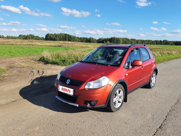 2010 Suzuki SX4 I (Classic) Рестайлинг, оранжевый
