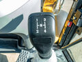 2024 New Holland B110C, жёлтый - вид 11
