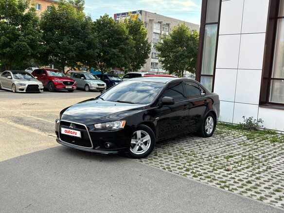 2010 Mitsubishi Lancer X, чёрный, 720000 рублей - вид 1