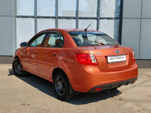 2010 Kia Rio II Рестайлинг, оранжевый - вид 3