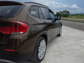 2010 BMW X1 18i I (E84), коричневый, 850000 рублей, вид 4