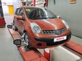 2007 Nissan Note I, красный, 420000 рублей - вид 2