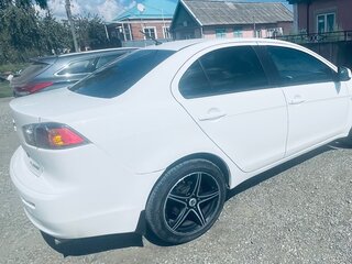 2011 Mitsubishi Lancer X Рестайлинг, белый, 650000 рублей, вид 4