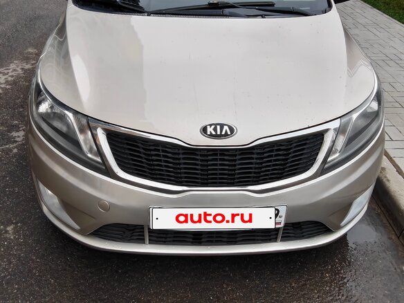 2014 Kia Rio 4-speed III, бежевый - вид 1
