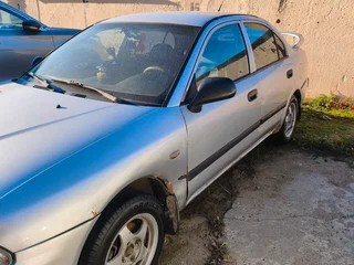 1999 Mitsubishi Carisma I Рестайлинг, серый, 195000 рублей, вид 2