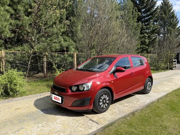 2012 Chevrolet Aveo II, красный, 750000 рублей