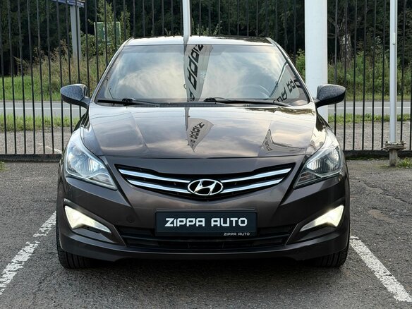2014 Hyundai Solaris I Рестайлинг, коричневый - вид 1