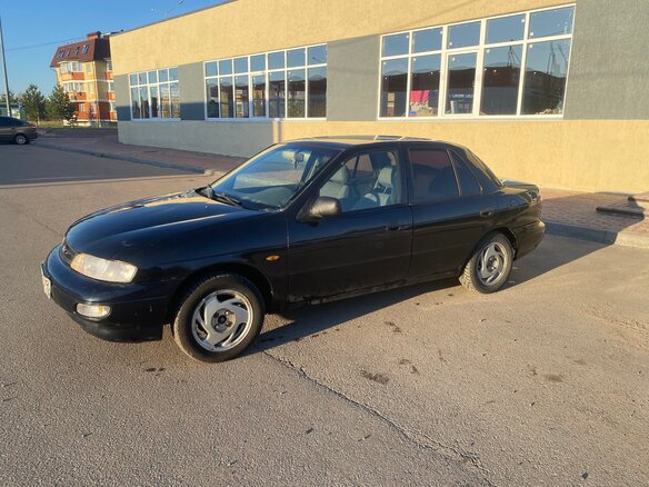 1998 Kia Sephia II, чёрный, 140000 рублей - вид 5