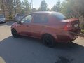 2009 Chevrolet Aveo I Рестайлинг, красный, 400000 рублей - вид 4