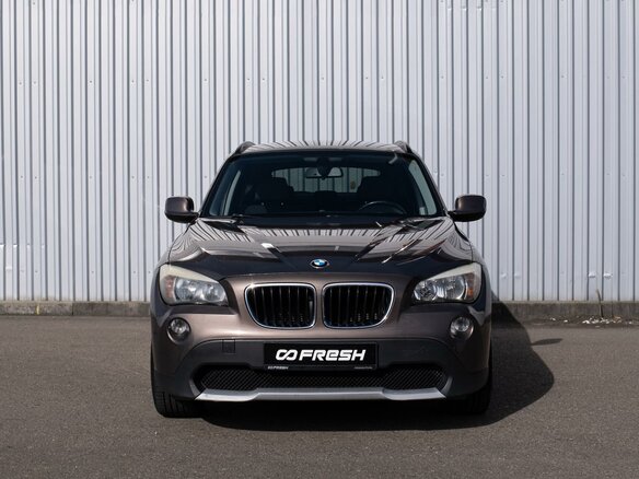2011 BMW X1 18i I (E84), коричневый - вид 2