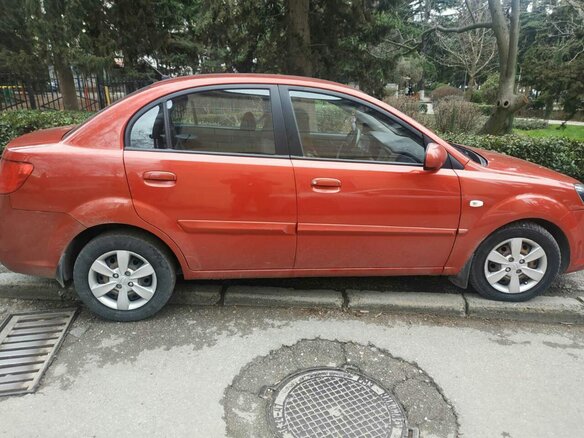 2010 Kia Rio II Рестайлинг, красный