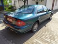 1999 Kia Clarus II, зелёный, 104437 рублей - вид 3