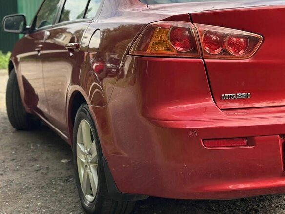 2008 Mitsubishi Lancer X, красный - вид 9