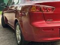 2008 Mitsubishi Lancer X, красный - вид 9