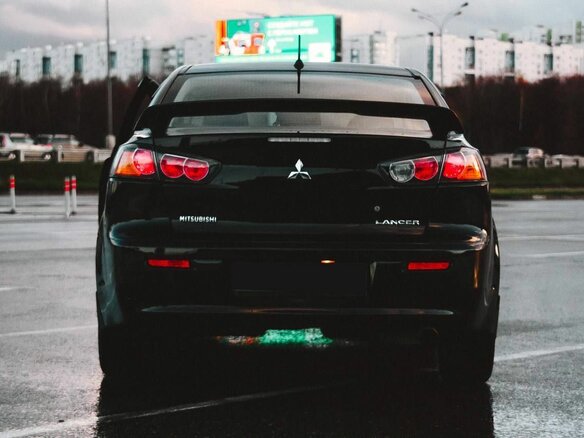 2012 Mitsubishi Lancer X Рестайлинг, чёрный, 750000 рублей - вид 4