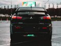 2012 Mitsubishi Lancer X Рестайлинг, чёрный, 750000 рублей - вид 4