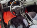 2008 Toyota Corolla AMT X (E140, E150), красный - вид 11