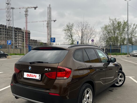 2012 BMW X1 18i I (E84), коричневый - вид 1