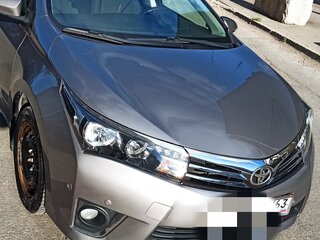 2013 Toyota Corolla XI (E160, E170, E180), коричневый, 1350000 рублей, вид 2