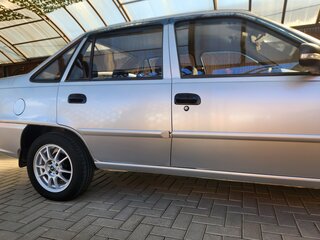 2014 Daewoo Nexia I Рестайлинг, серебристый, 490000 рублей, вид 2