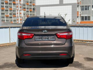 2014 Kia Rio 5-speed III, коричневый, 776000 рублей, вид 5