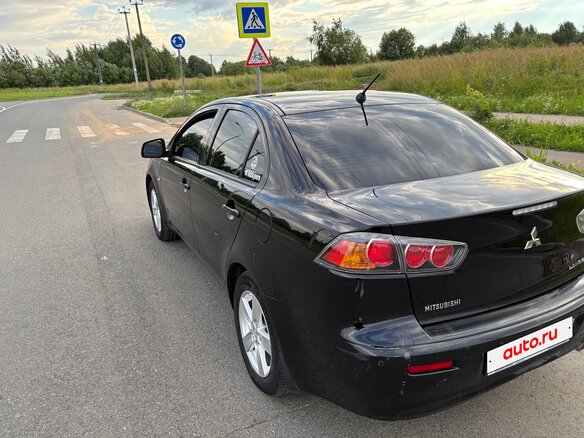 2010 Mitsubishi Lancer X, чёрный, 720000 рублей - вид 4