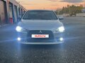 2012 Mitsubishi Lancer X Рестайлинг, серебристый, 720000 рублей - вид 2