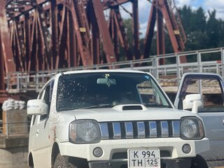2011 Suzuki Jimny Kei car III Рестайлинг 1, белый, 950000 рублей, вид 2