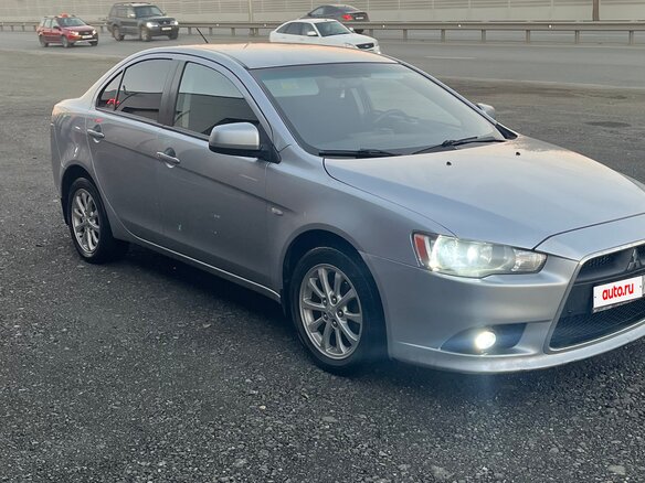 2012 Mitsubishi Lancer X Рестайлинг, серебристый, 720000 рублей - вид 3