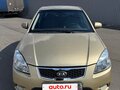 2011 Kia Rio II Рестайлинг, бежевый - вид 1