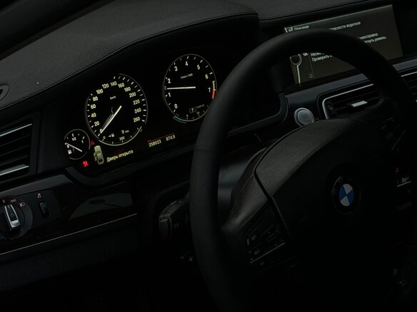 2011 BMW 7 серии 750i xDrive V (F01/F02/F04), чёрный - вид 7