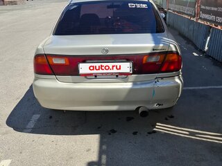 1995 Mazda Familia VII (BH), золотистый, 155000 рублей, вид 4
