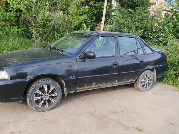 2011 Daewoo Nexia I Рестайлинг, чёрный - вид 1