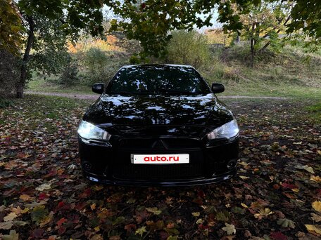 2011 Mitsubishi Lancer X Рестайлинг, чёрный, 730000 рублей, вид 3