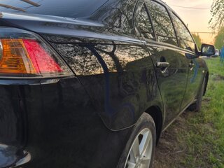 2011 Mitsubishi Lancer X Рестайлинг, чёрный, 740000 рублей, вид 4