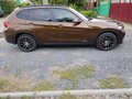 2013 BMW X1 20i I (E84) Рестайлинг, коричневый, 1360000 рублей - вид 3